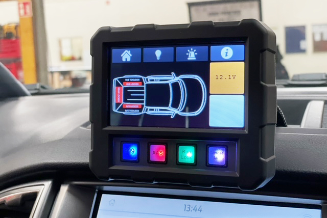 Touch Screen Handset munted on vehicle dash Showing Vehicle Overview and various buttons