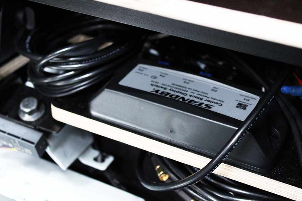 Close up of Standby CSDS unit, upside down angle, surrounded by wires