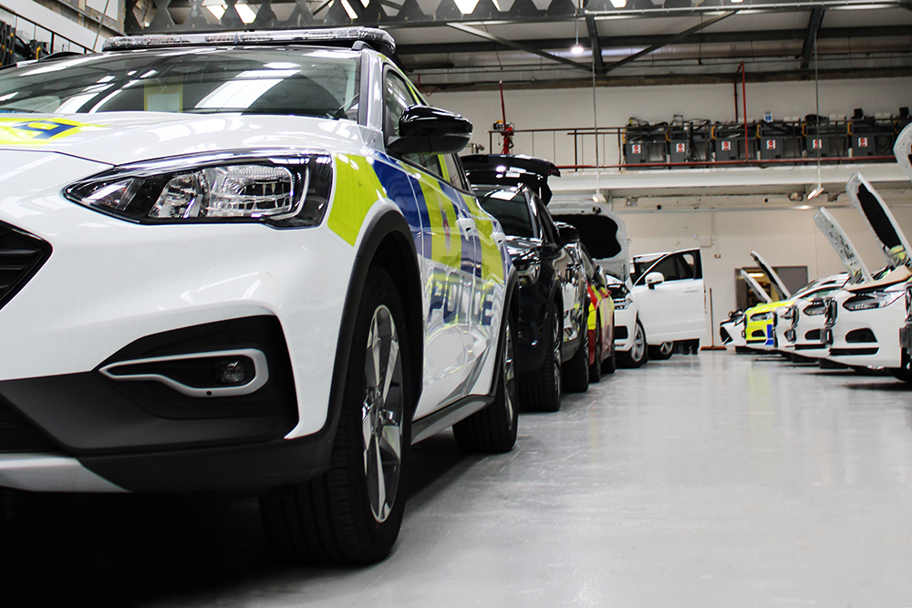 Halls Electrical Workshop View with forward / diagonal facing cars in lefthand side of image and side / diagonal facing cars in righthand side of image