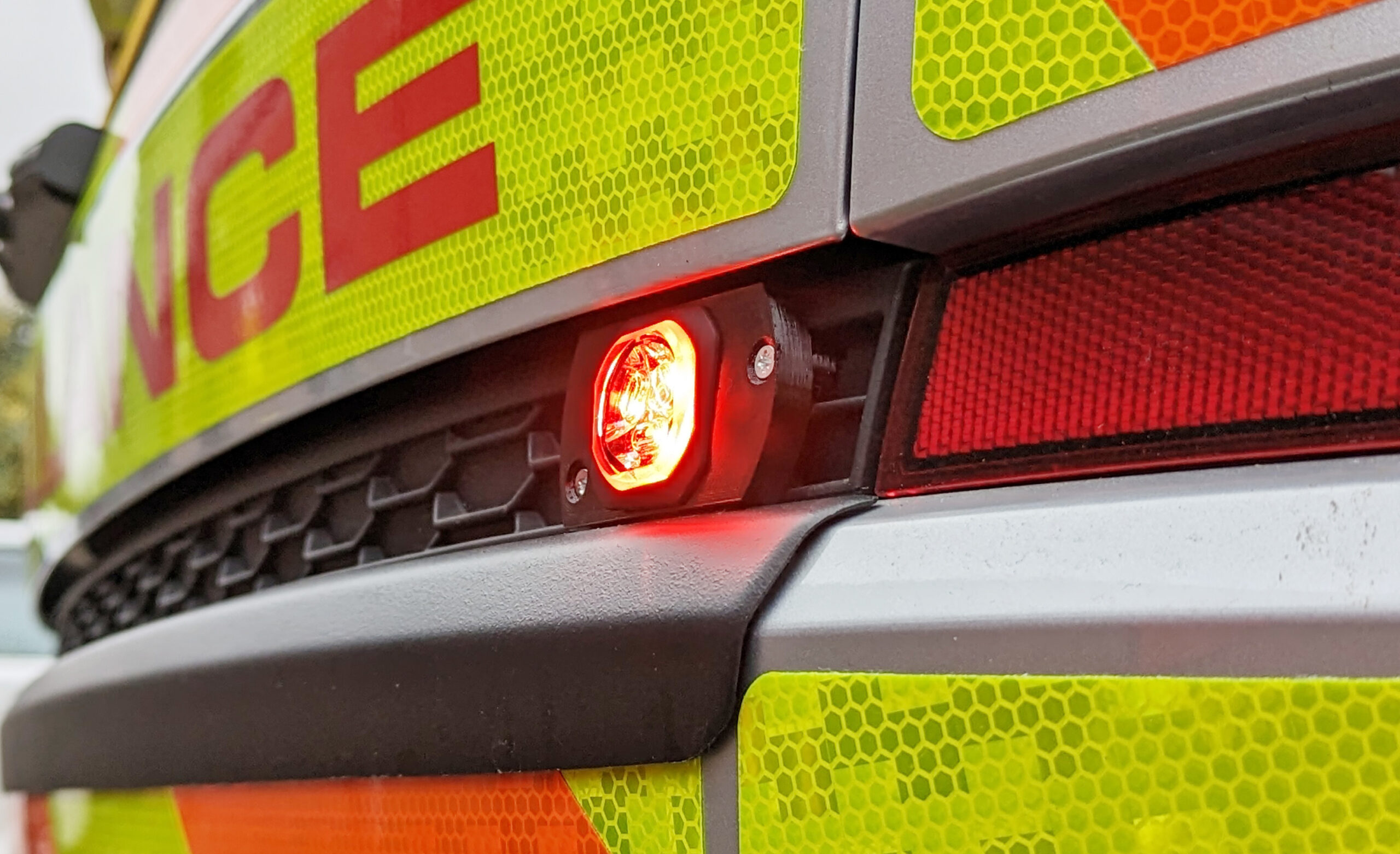 Closely Cropped Shot of Red Microburst In Situ on Ambulance Rapid Response Vehicle