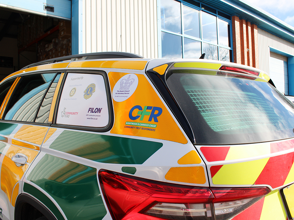 Close up angle view of the back end of a response vehicle with Burntwood & Cannock Chase Community First Responders Livery.