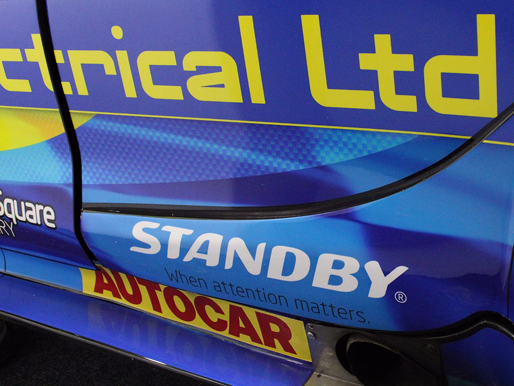 Close up of livery on BTCC driver Max Hall's car with Standy UK logo in white