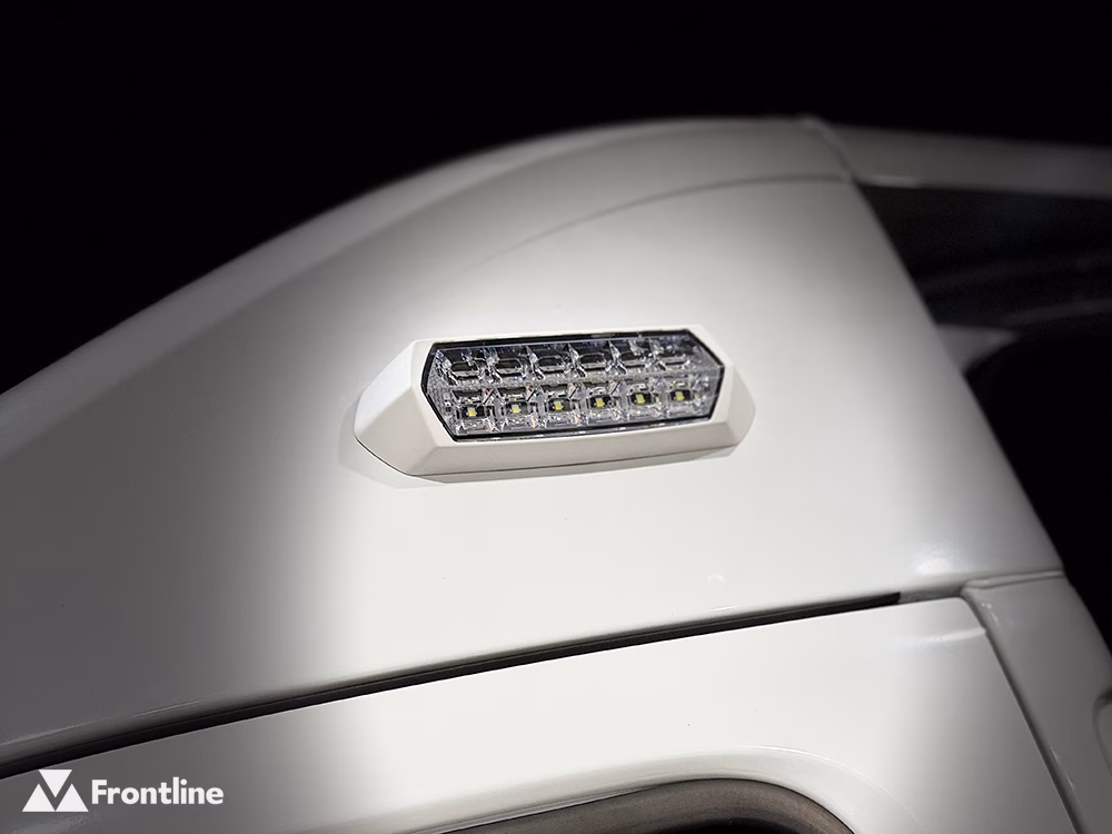 Close up of an unlit SceneMax Combo LED with white bezel mounted above the driver door of a white vehicle.